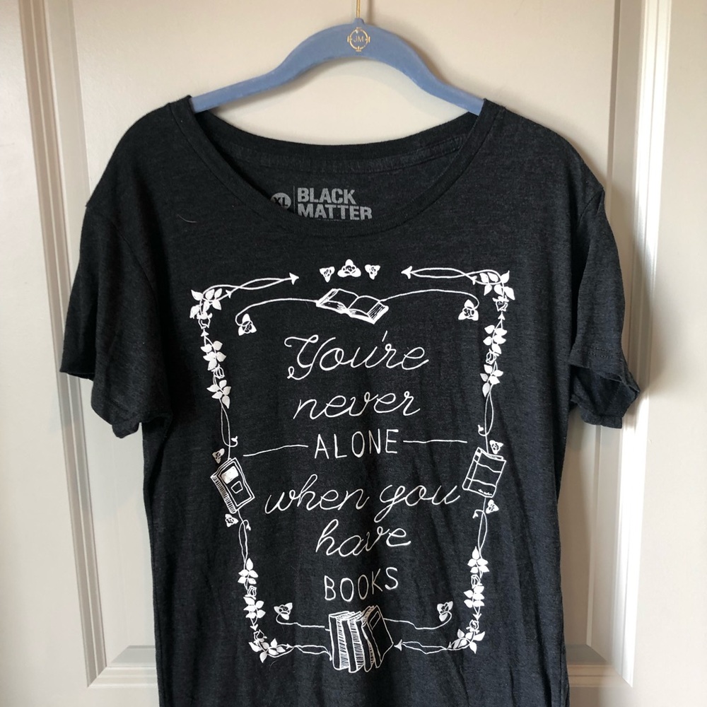Graphic tee: “you’re never alone”